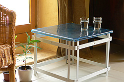 Table basse verre et alu Potager rotin